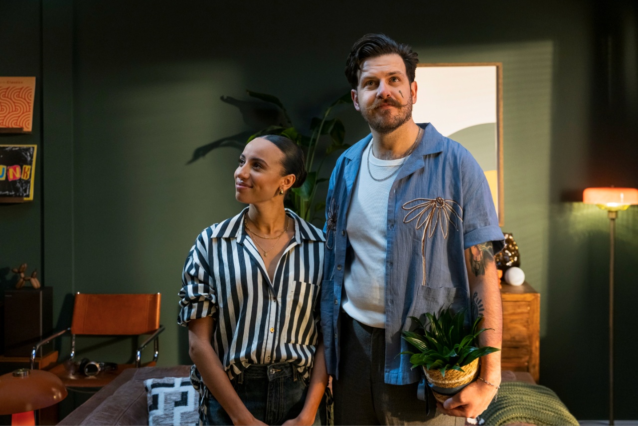 Couple standing in living room together