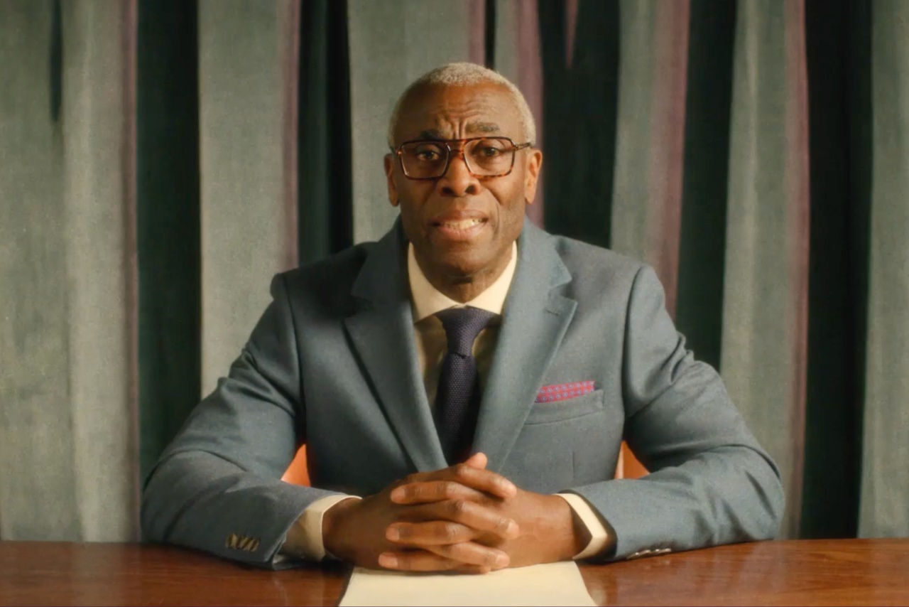 Phil Gayle sitting at desk