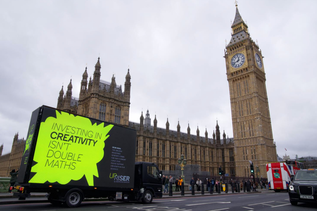 Van outside Houses of Parliament and Big Ben