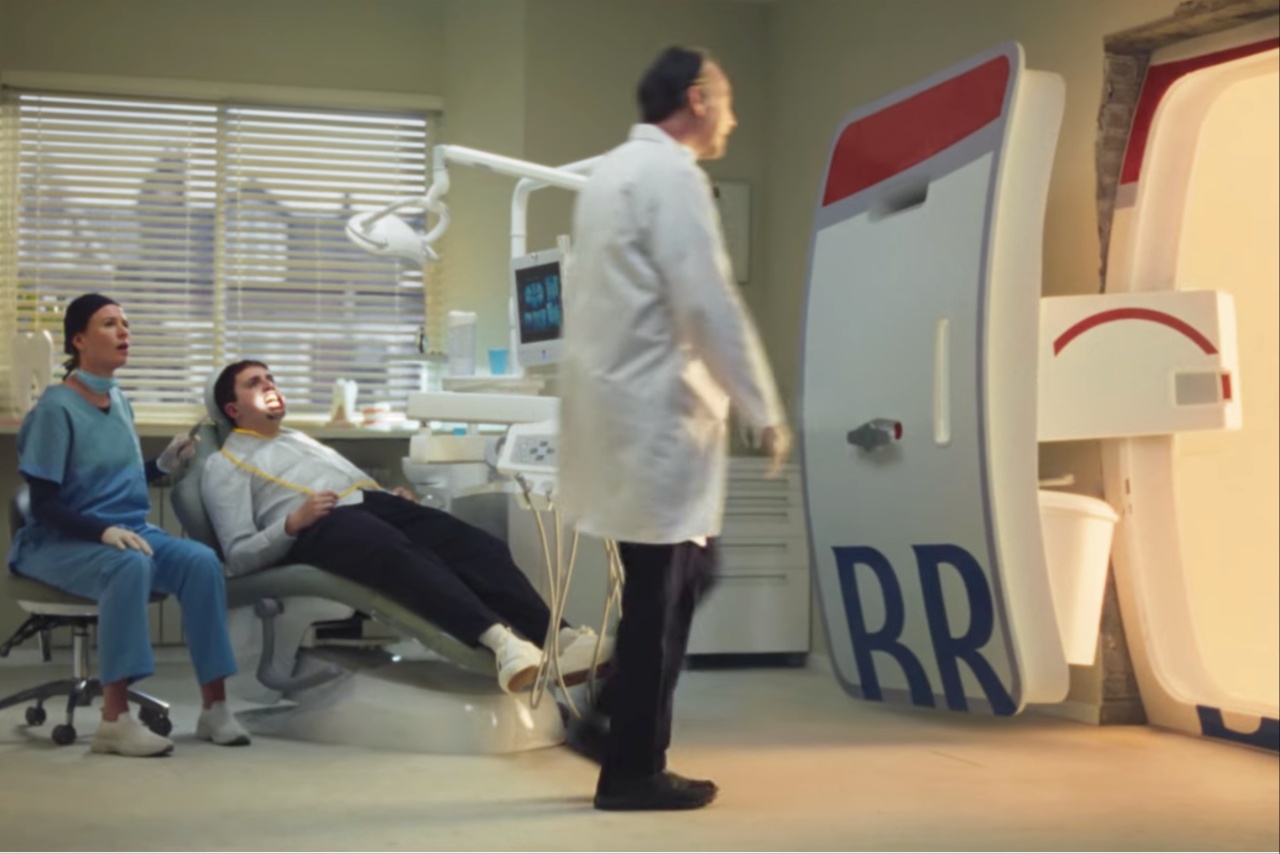Dental patient and nurse watch dentist walk out of office onto British Airways plane