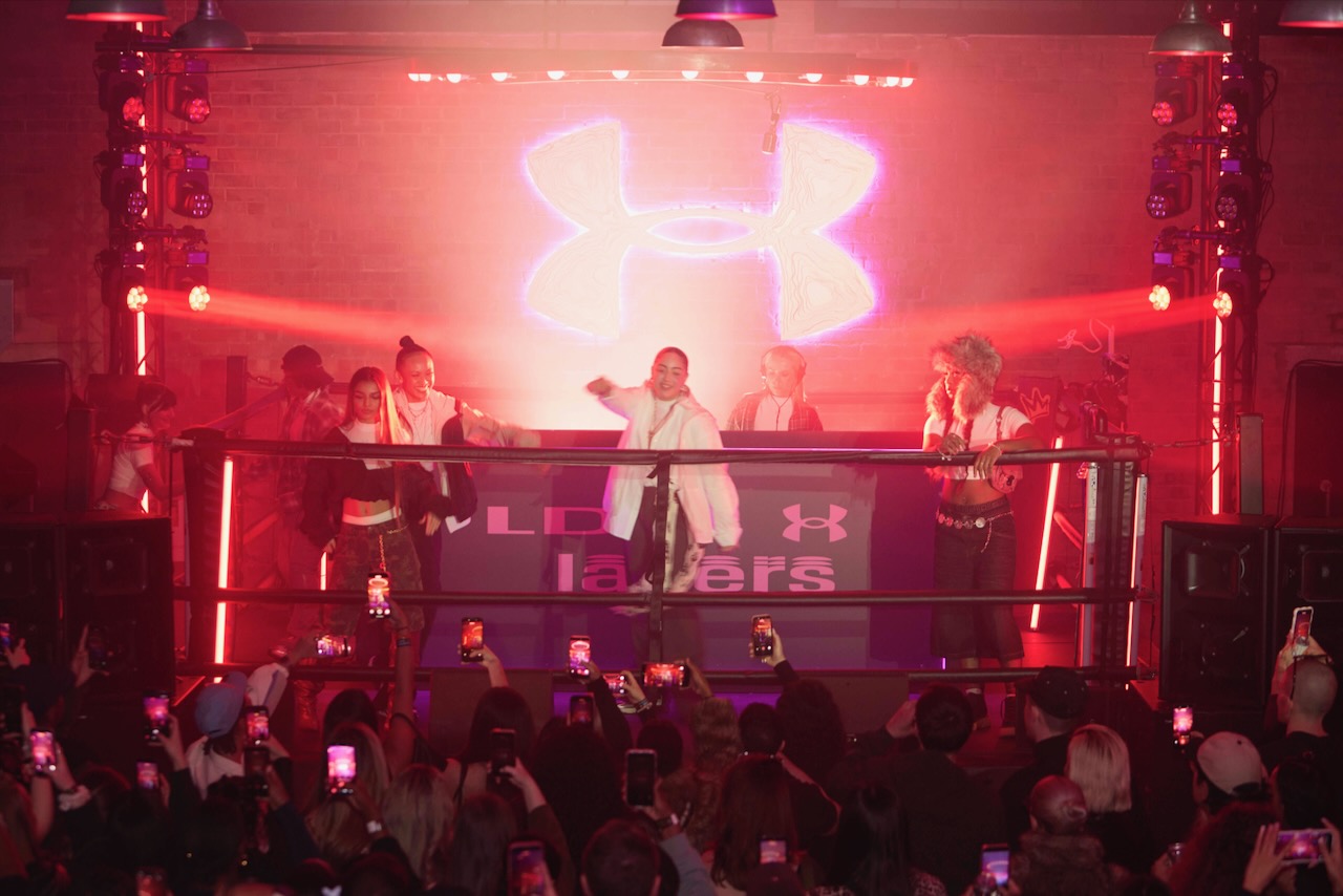 A party promoting Under Armour's Women's Crop Mock Baselayer