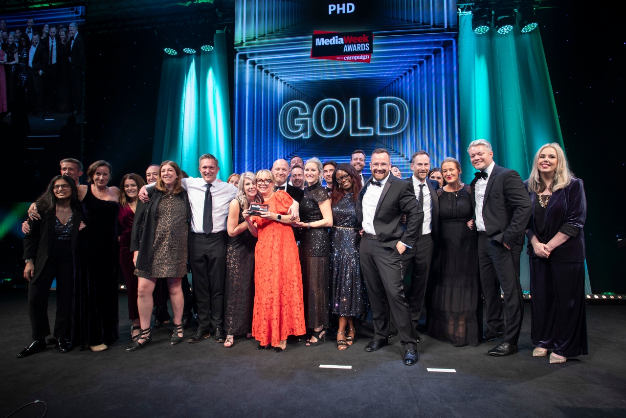 A group of people from PHD stand onstage having accepted their Media Agency of the Year award for Campaign's Media Week Awards.