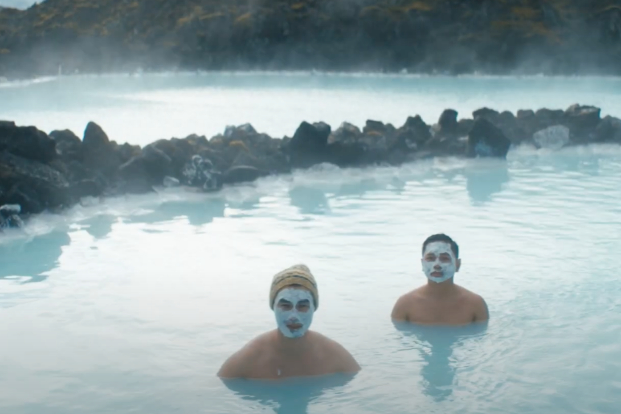 Men standing in Iceland's Blue Lagoon