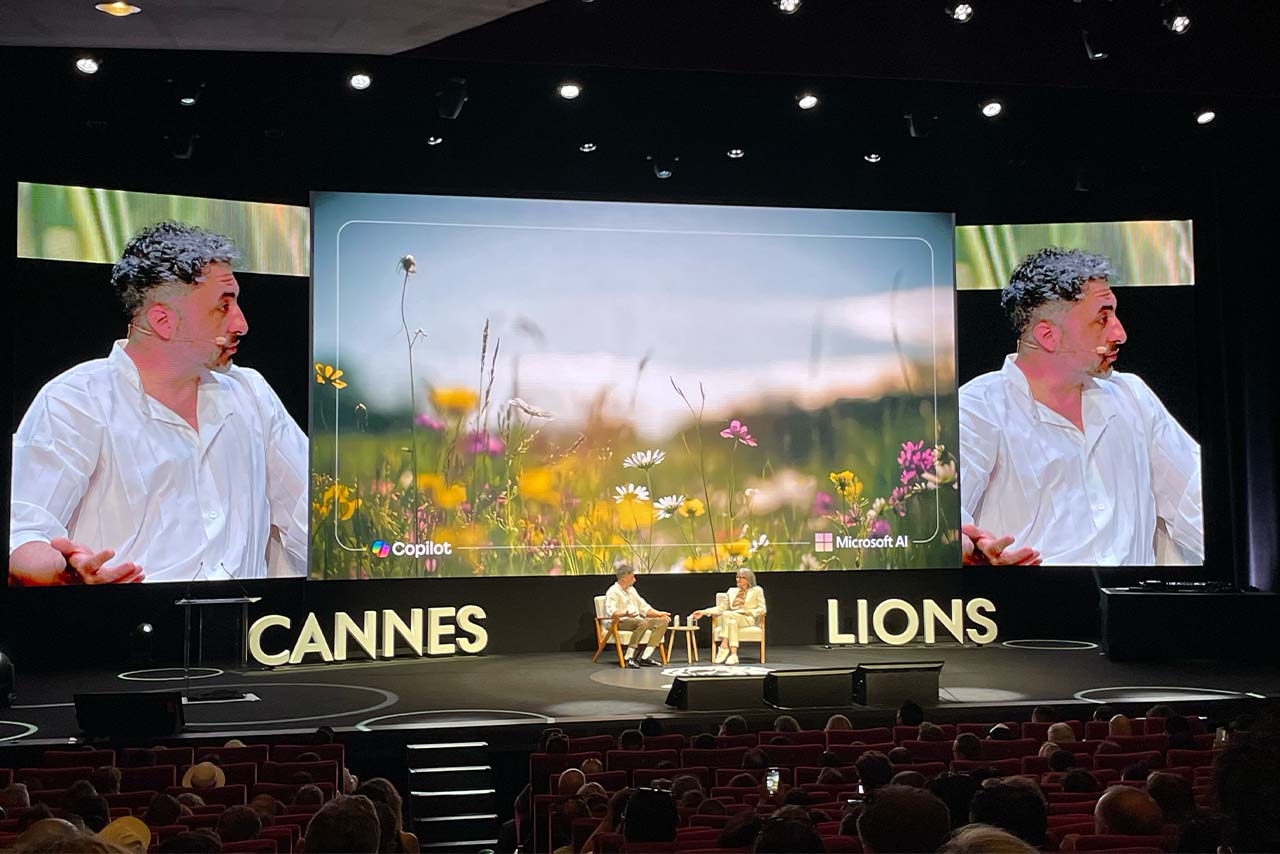 Mustafa Suleyman on stage with Colleen DeCourcy